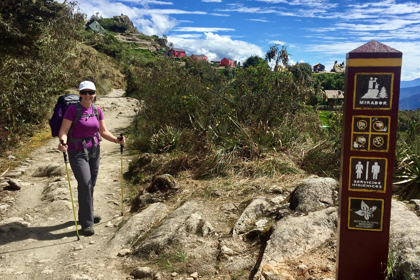 Why use rubber tips on hiking poles Hiker using rubber tips on trekking poles on the inca trail in peru, where protective pole covers are mandatory
