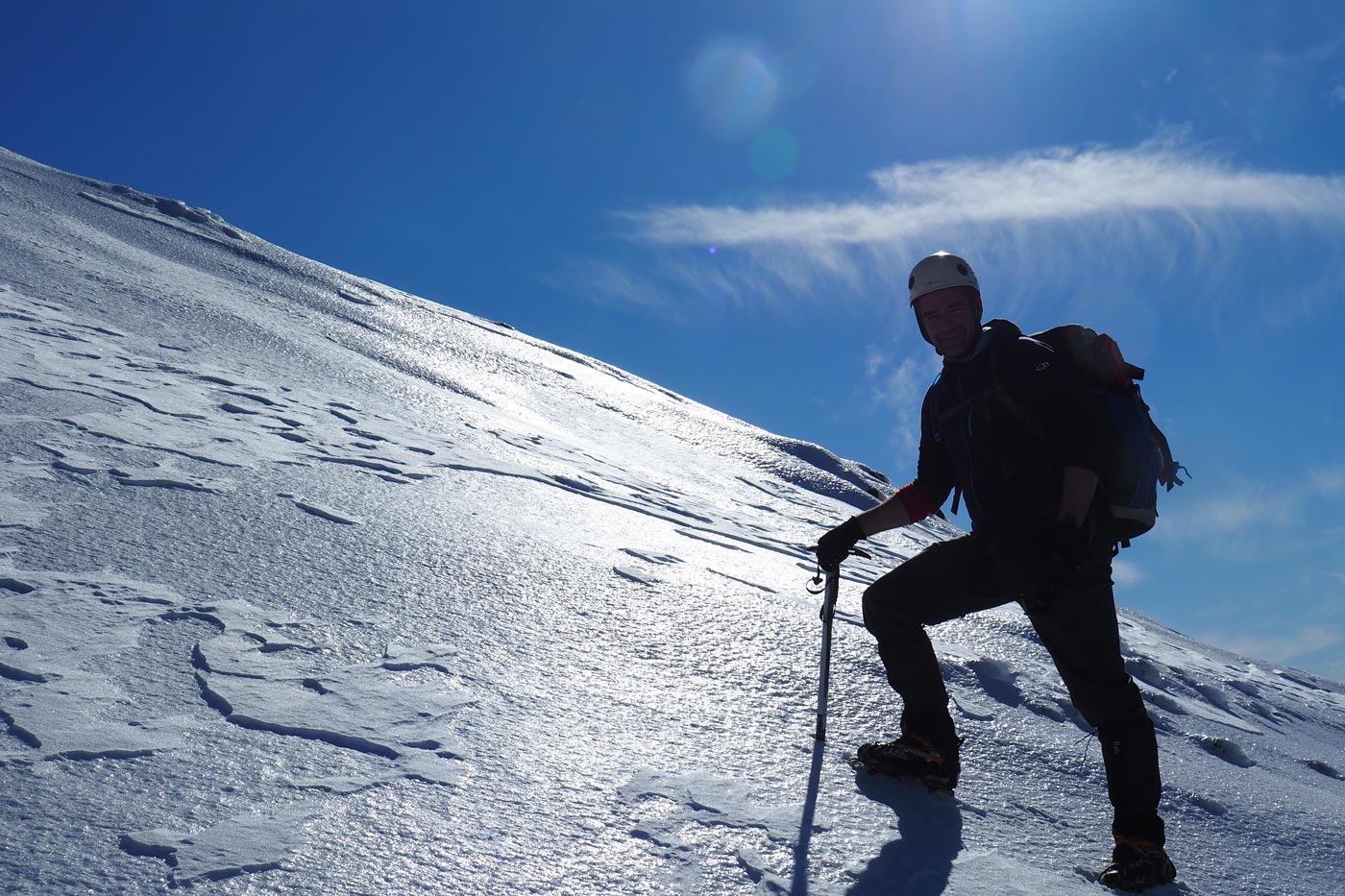 Climbing mount buller in winter using strap-on crampons on firm, icy snow