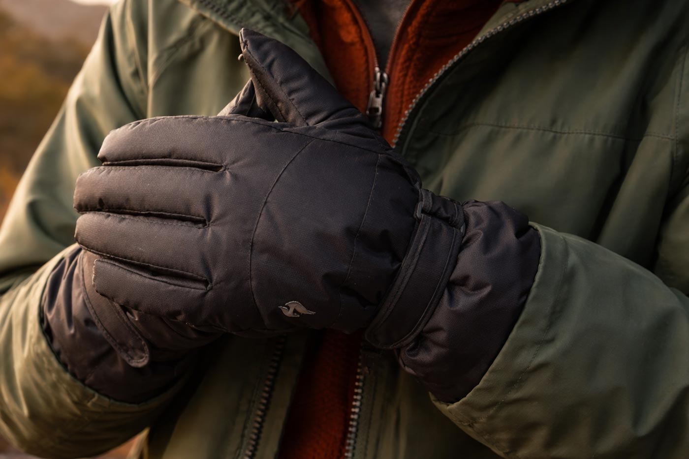 Close-up of insulated winter hiking gloves designed for sustained cold conditions