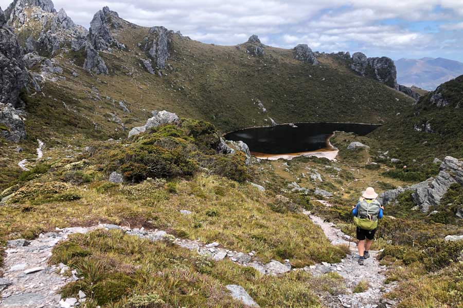 Lake-Cygnus-nestled-in-a-120-meter-deep-cirque Image of julie descending towards lake cygnus