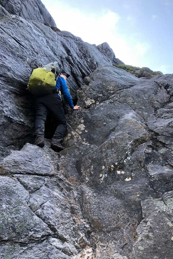 sheer-rock-face Image of julie climbing a sheer rock face
