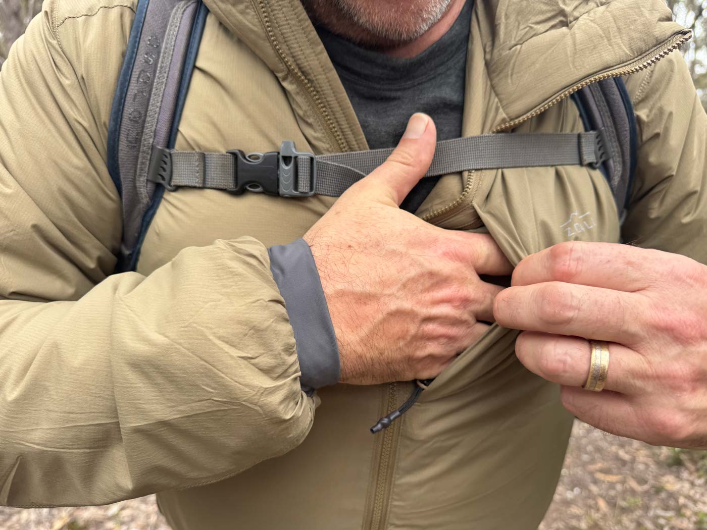 Chest pocket provides quick, secure access for small essentials.
