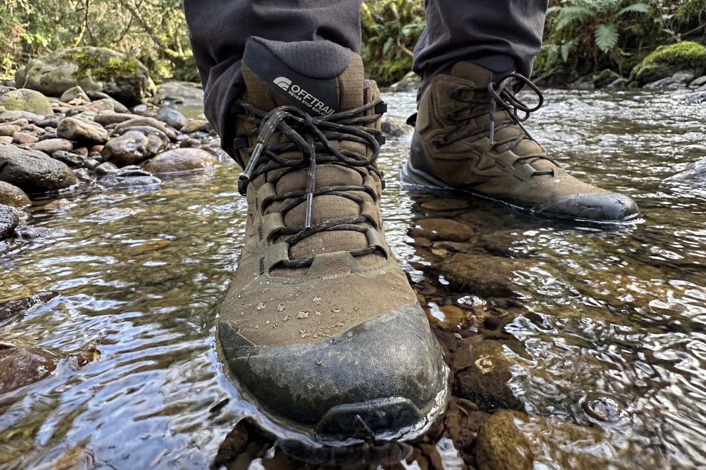 The north face offtrail hike lt mid gore-tex boots standing in shallow creek showing waterproof performance