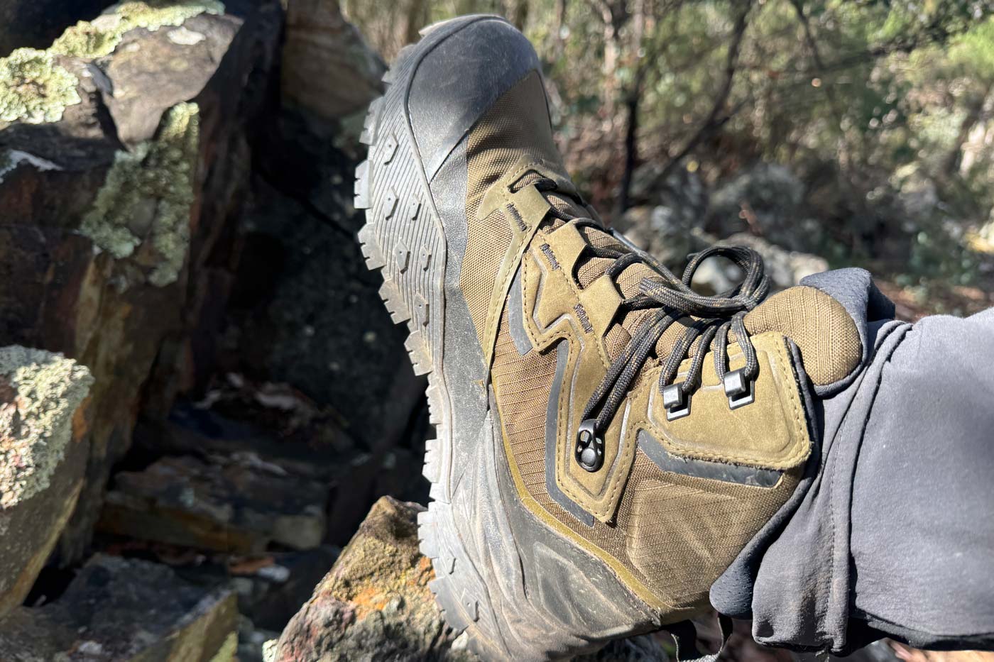 The north face offtrail hike lt mid gore-tex boot side view showing cordura upper, overlays and toe cap on rocky terrain