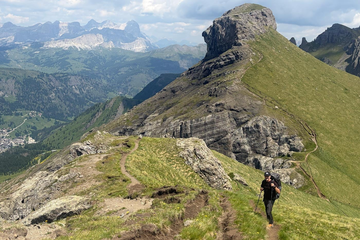 Hiker wearing a snowgum merino 180 merano tee trekking through the dolomites during an alta via 2 alpine hike
