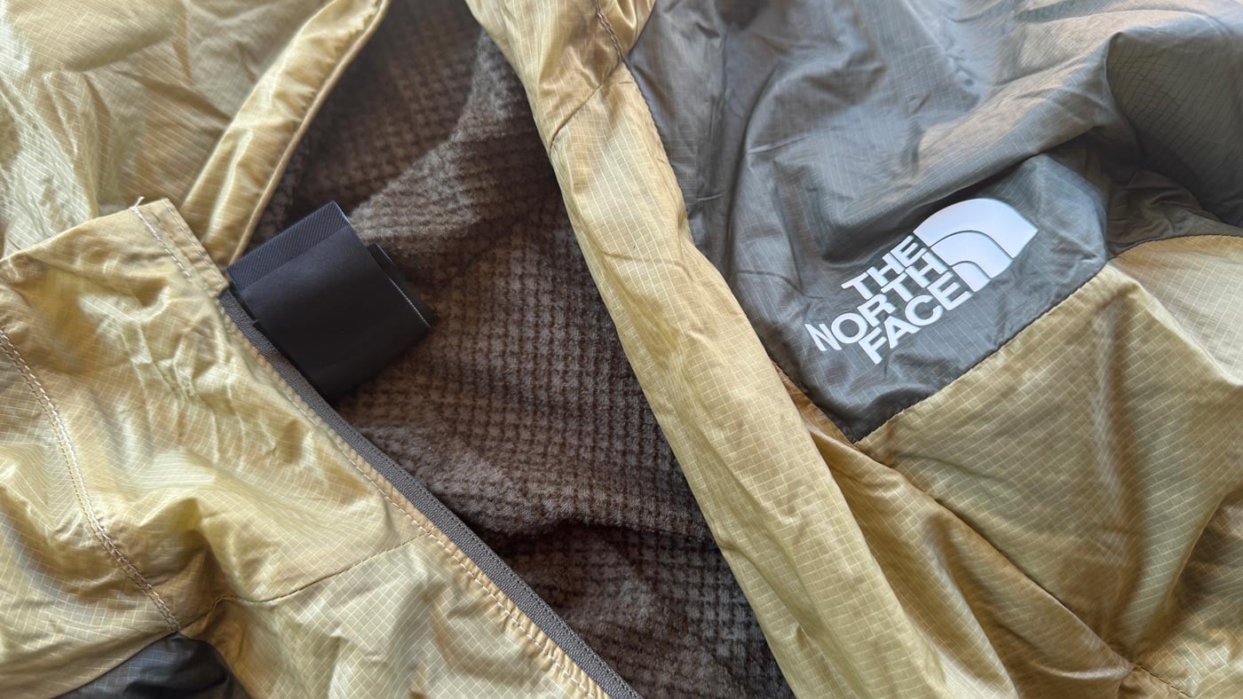 Close-up of the ridgelite futurefleece wind jacket showing the lightweight outer fabric, soft fleece lining, and internal construction details.