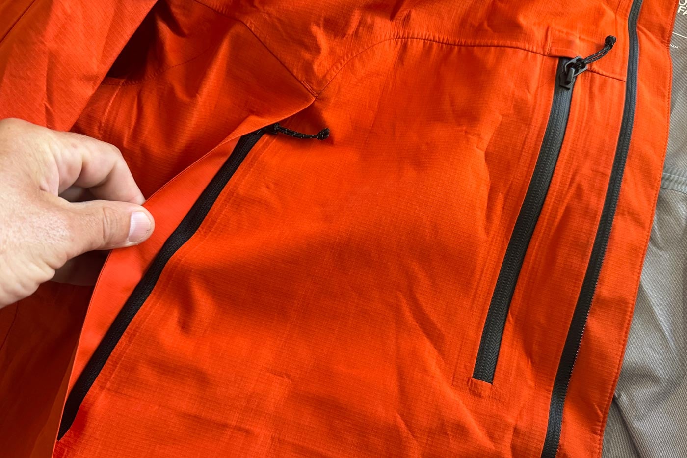 Close-up of the valley view jacket showing the vertical chest pockets and water-resistant zip design.